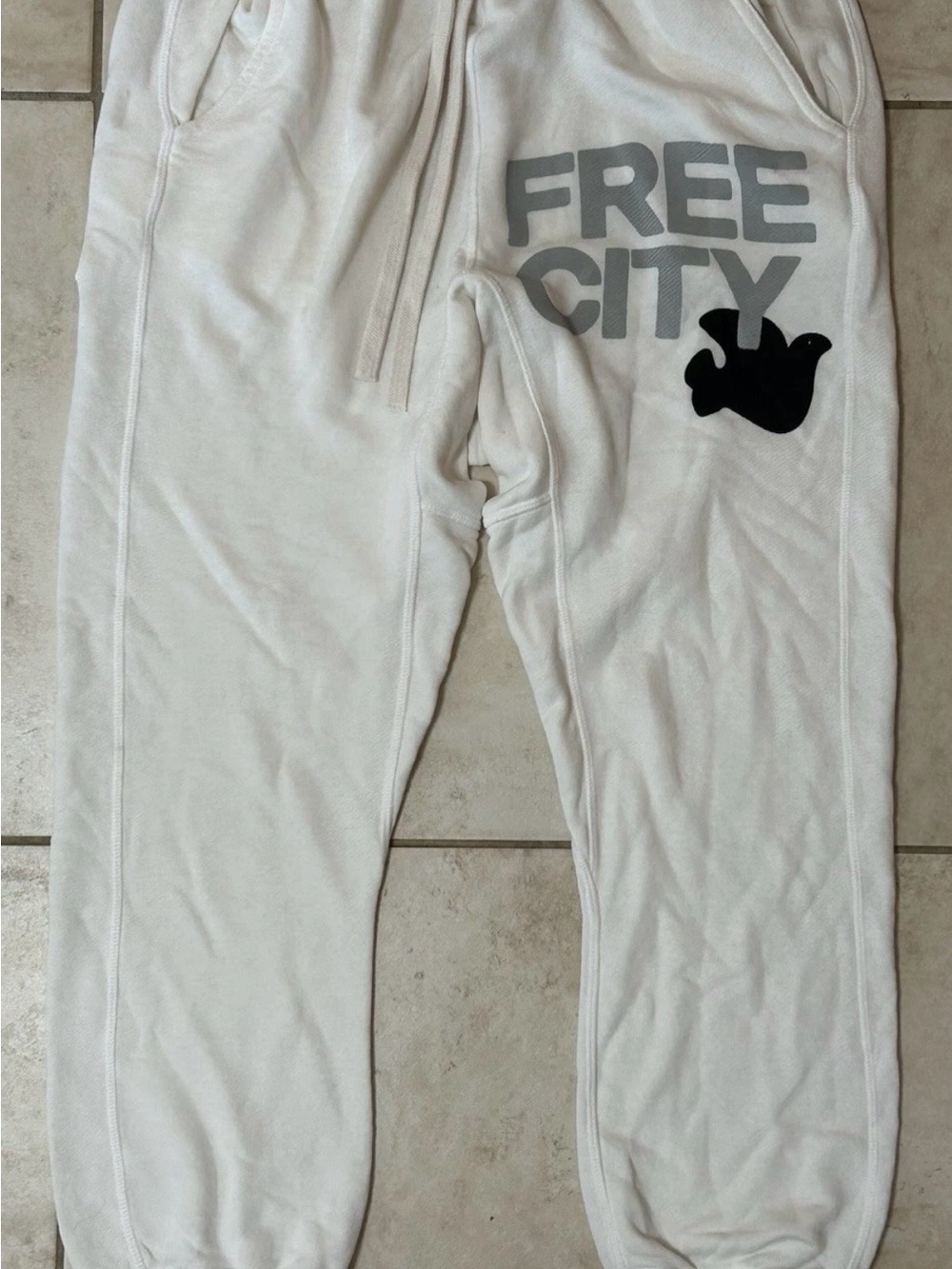 freecity super fluff Cream Sweatpants with Gray Logo and Black Graphic